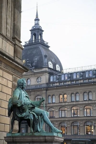 Copenhagen, Denmark - A statue of a man sitting in a chair wearing 18th century clothes