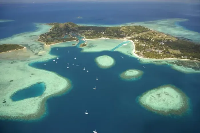 Framed Print : Coral reef and Musket Cove Island Resort (left), Plantation Island Resort (right)