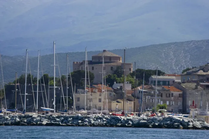 Framed Print : Corsica. France. Europe. Mast of boats & breakwater below citadel & other buildings of St Framed Print : Corsica. France. Europe. Mast of boats & breakwater below citadel & other buildings of St