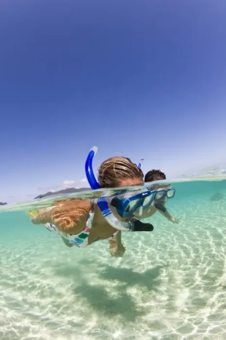 Framed Print : couple (age 23 and 24) enjoying snorkeling the clear tropical waters of a remote island