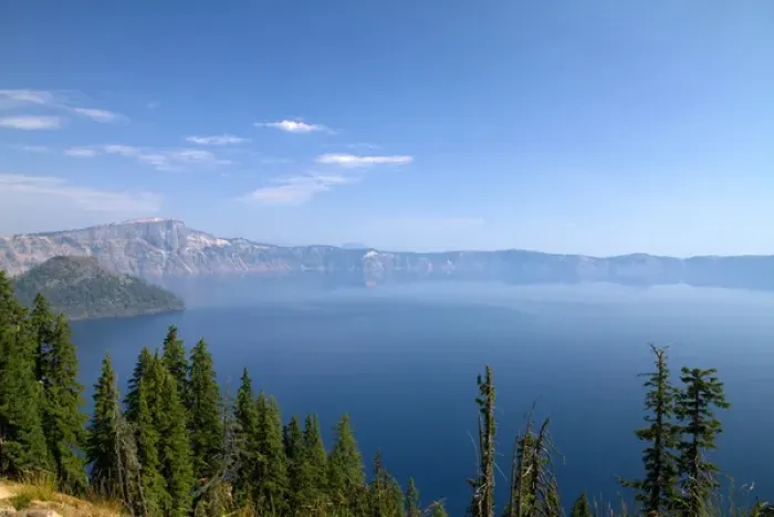 Framed Print : Crater Lake shrouded in smoke from forest fires in Crater Lake National Park located Framed Print : Crater Lake shrouded in smoke from forest fires in Crater Lake National Park located
