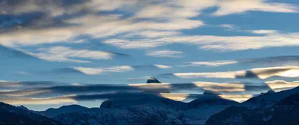 crepuscular Shadows cast by Teton Peaks before Sunrise. Altocumulus lenticularis clouds