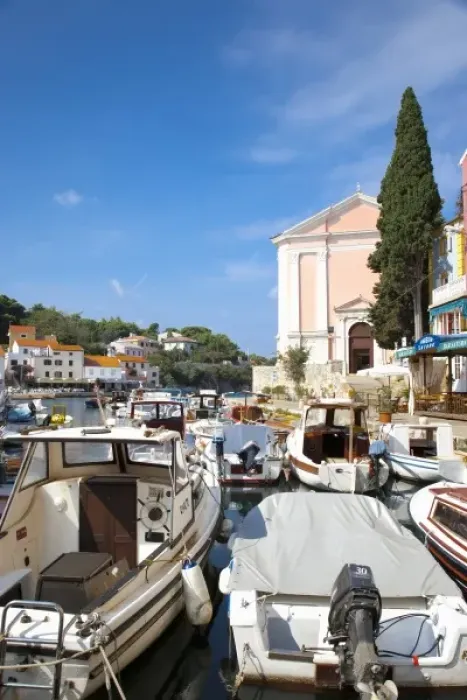 Framed Print : Cres, Coatia - High angle view of boats on a marina. Colorful buildings can be seen