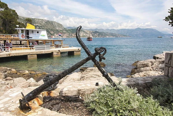 Croatia, Dubrovnik. Ferry dock Lokrum Island framed by old anchor