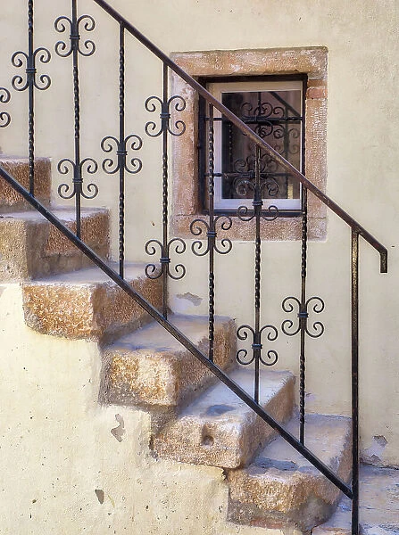 Croatia, Rovinj, Istria. Stairs and wrought iron railing leading to a home