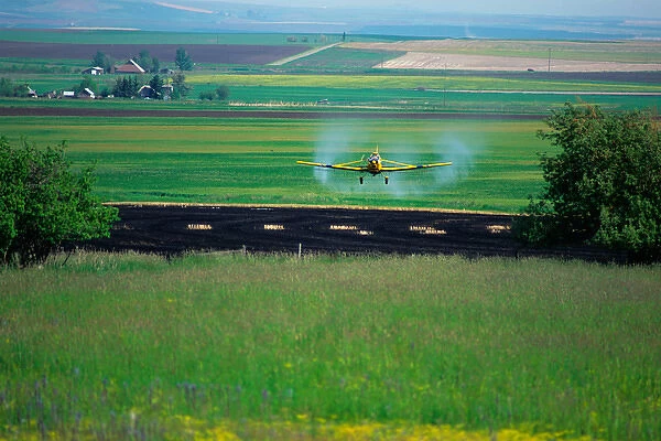 Cropduster spraying a field near Grangeville, Idaho. cropdusting, cropduster