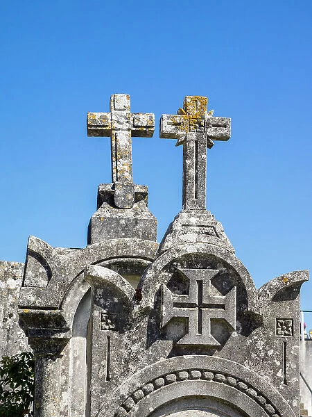 Cross at the top of an ancient gravestone in the cemetery at the Castelo de Ourem, a Portuguese National Monument
