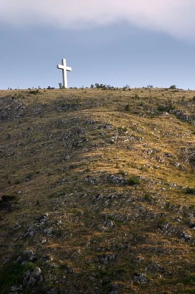 A cross on a hilltop near the city. Historic town of Mostar. Federation Bosne i Hercegovine