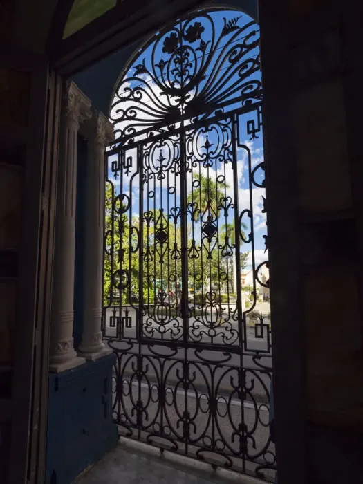 Framed Print : Cuba, Camaguey, UNESCO World Heritage Site, wrought iron grill in giant window of colonial mansion