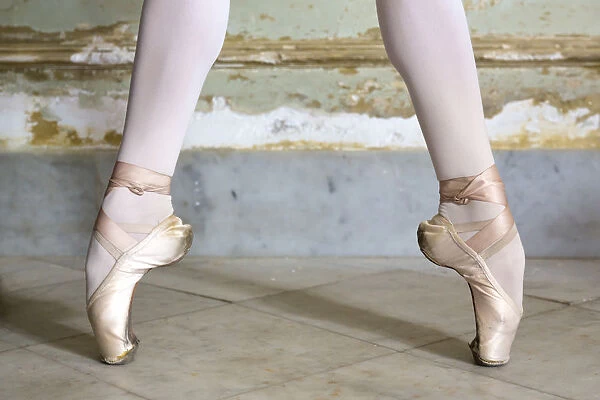 Cuba, Havana. Ballet position of ballerinas legs and feet