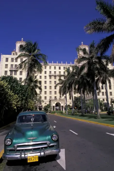 Framed Print : Cuba, Havana. Classic 1950s auto in front of Habana Nacional Hotel