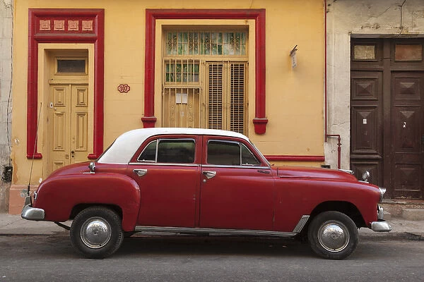 Cuba, Havana. Classic car parked on the street