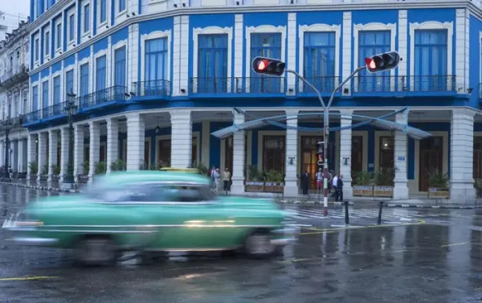 Framed Print : Cuba, Havana. A classic car passes by in a rainstorm the city Framed Print : Cuba, Havana. A classic car passes by in a rainstorm the city