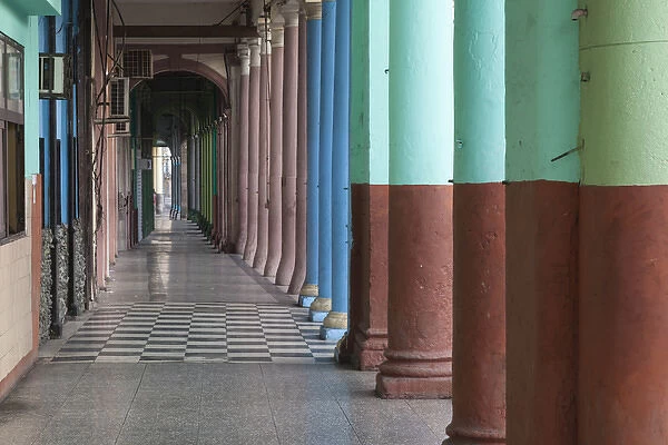 Cuba, Havana. Repeating columns of an arcade along the Paseo del Prado