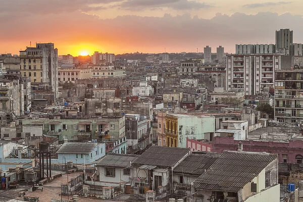 Cuba, Havana. The sun sets over the crowded, decaying city of Havana
