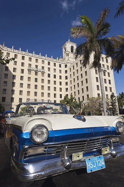 Cuba, Havana, Vedado, Hotel Nacional and 1950s-era US car, late afternoon