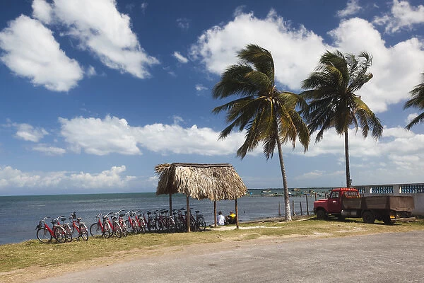 Cuba, Pinar del Rio Province, Puerto Esperanza, bicycles by the seashore