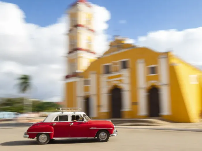 Framed Print : Cuba, Remedios, classic red car in front of Cathedral