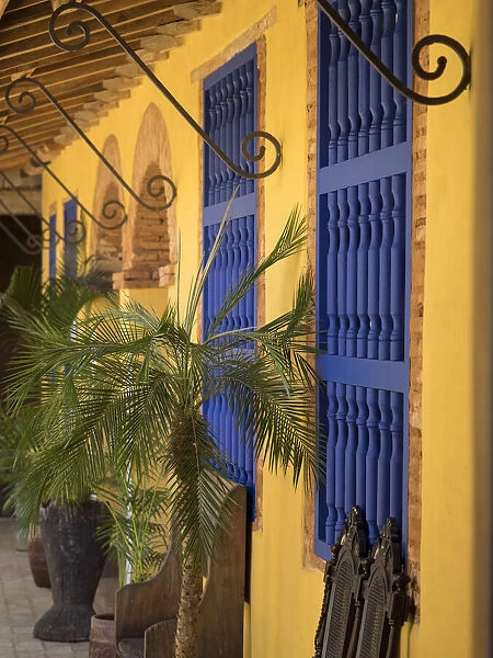 Cuba, Trinidad, UNESCO World Heritage Site, blue shutters in courtyard of Casa Particular, Spanish style colonial home. (PR)
