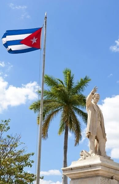 Cuban flag and statue in center of town of Jose Marti hero in CVienfuegos Cuba