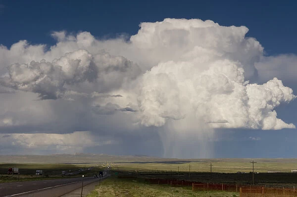 Cumulus clouds and virga hitting the ground (observable streak or shaft of precipitation