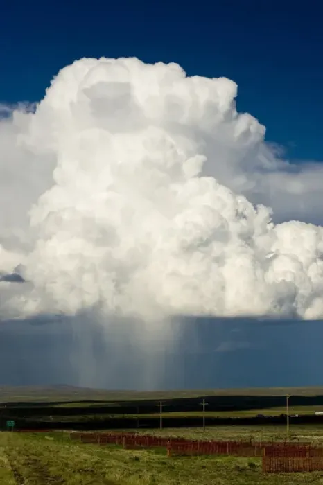 Framed Print : Cumulus clouds and virga hitting the ground (observable streak or shaft of precipitation