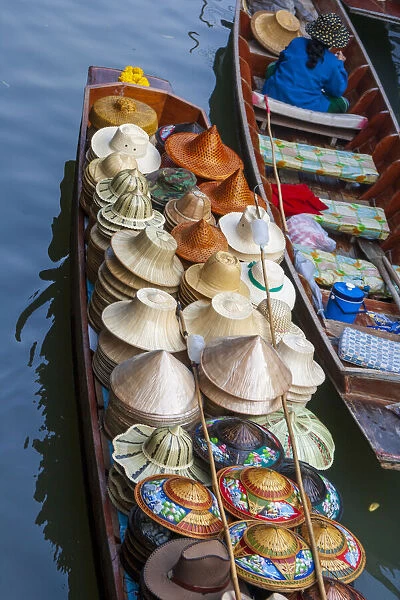 Damnoen Saduak Floating Market, Bangkok, Thailand. Boatload of hats for sale