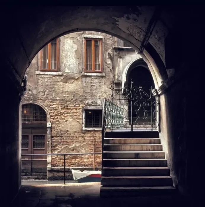 Framed Print : A delicate wrought iron gate marks the entrance to an old home on a small canal in Venice Framed Print : A delicate wrought iron gate marks the entrance to an old home on a small canal in Venice