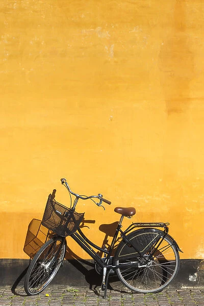 Denmark, Zealand, Copenhagen, yellow building detail with bicycle