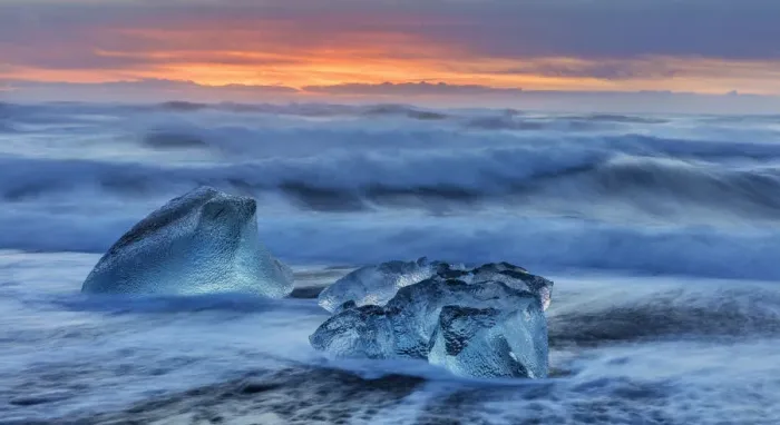 Framed Print : Diamond ice chards from calving icebergs on black sand beach at Jokulsarlon in south Framed Print : Diamond ice chards from calving icebergs on black sand beach at Jokulsarlon in south