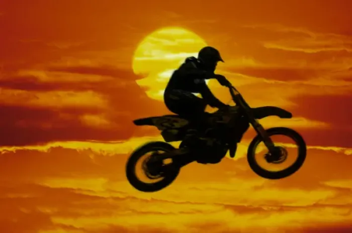 Framed Print : Digital composite of motocross racer doing jump in front of big sun Framed Print : Digital composite of motocross racer doing jump in front of big sun