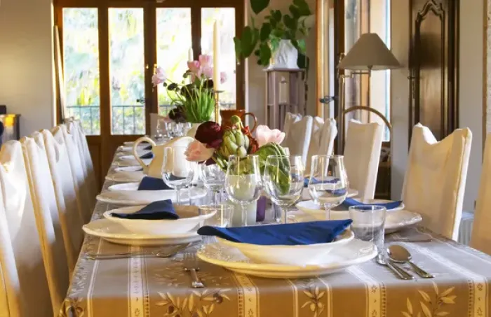 Framed Print : The dining room table decorated and set with flowers and decorative vegetables for dinner guests Framed Print : The dining room table decorated and set with flowers and decorative vegetables for dinner guests