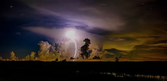 Framed Print : A distant thunder storm and sky draws contrast to the dark Big Cypress prairie