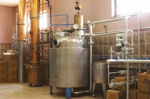 Distillation machine still with steel and copper boiler and column to make grape juice spirit