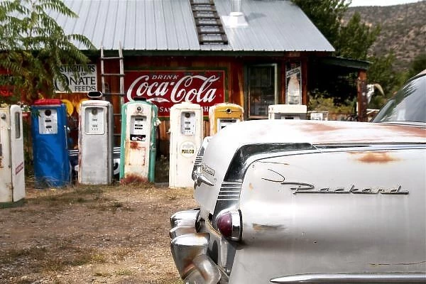 Dixon, New Mexico, United States. Vintage car and gasoline pumps