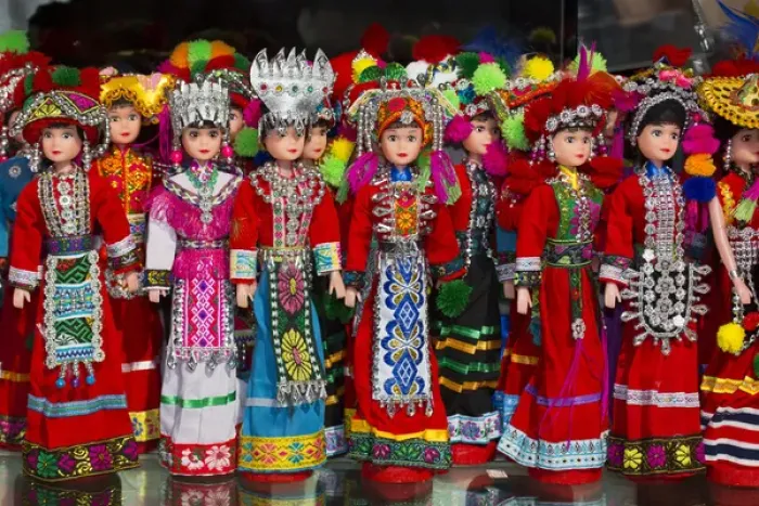 Framed Print : Dolls on display in Ethnic Native Dress, Kunming Ethnic Minorities Villiage Park, China