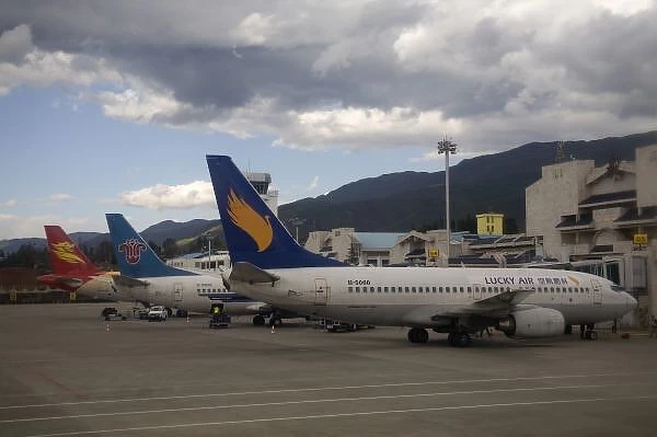 Domestic Chinese jet airliners lined up at departure gates at Lijiang Airport