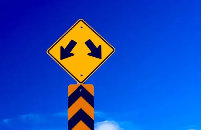 Framed Print : a double arrow traffic sign with a blue sky behind Framed Print : a double arrow traffic sign with a blue sky behind