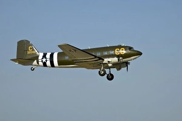 Douglass DC-3  /  C-47 C-8 with D-Day Invasion Stripes in the sky