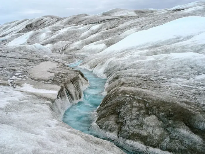 Framed Print : Drainage system on the surface of the ice sheet. The brown sediment on the ice is created by the rapid melting of the ice. Landscape of Greenland near Kangerlussuaq, Kingdom of Denmark