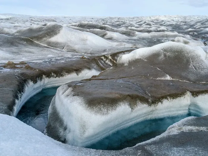 Framed Print : Drainage system on the surface of the ice sheet. The brown sediment on the ice is created by the rapid melting of the ice. Landscape of Greenland near Kangerlussuaq, Kingdom of Denmark
