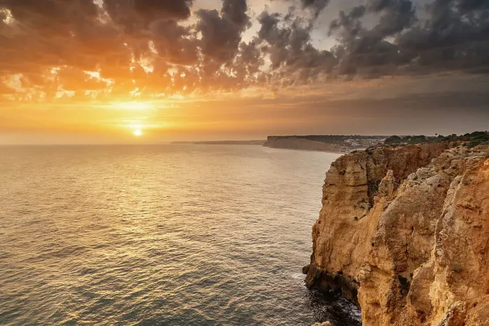 Framed Print : Dramatic sunset clouds over Cliffs along the coast at Ponta da Piedade in Lagos, Portugal Framed Print : Dramatic sunset clouds over Cliffs along the coast at Ponta da Piedade in Lagos, Portugal