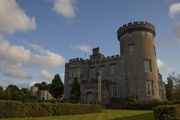 Dromoland Castle Hotel in Newmaket-on-Fergus, Ireland, side view under a blue sky