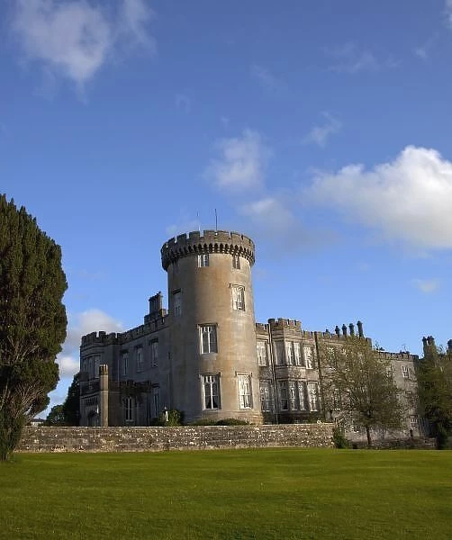 Dromoland Castle Hotel in Newmaket-on-Fergus, Ireland, side view with a large lawn