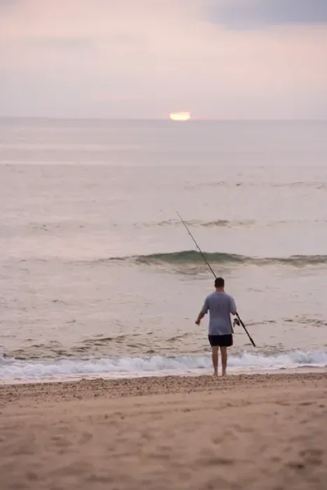 Framed Print : Early morning surfcasting on the beach at Cape Cod National Seashore in Massachusetts