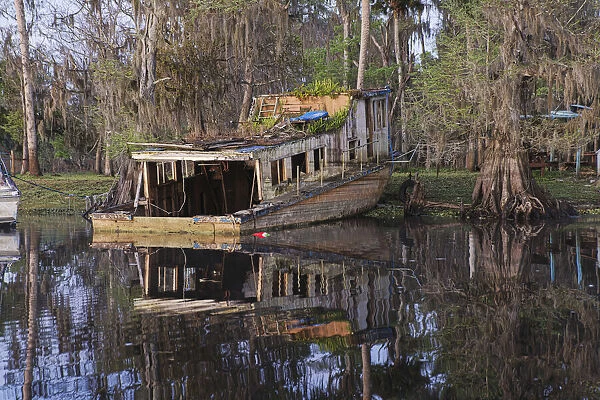 Early spring view of old abandoned boat, blackwater area of St. Johns River, central Florida