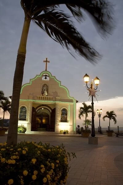 Ecuador, Guayaquil. Atop the hill of Las PeA as, a Catholic church sits across from a lighthouse