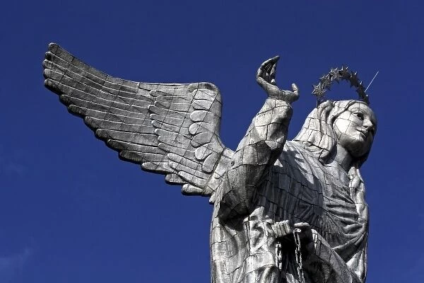 Ecuador, Quito. The Virgin of Panecillo watches over the capitol of Ecuador against a blue sky