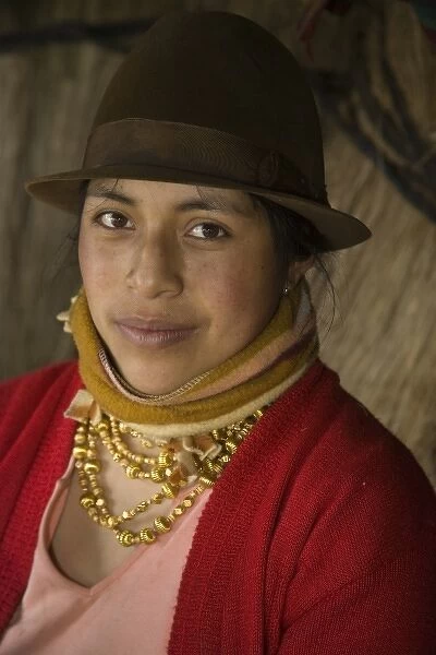 Ecuador, Zumbahua, woman in thatched hut. (MR)