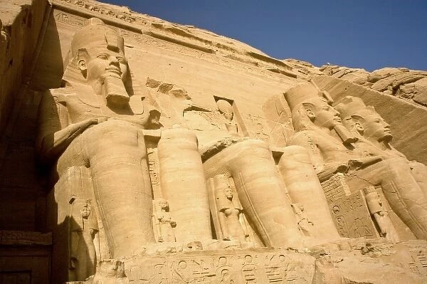 Egypt, Abu Simbel. Colossal statues adorn the entrance to the 13th Century BC Temple